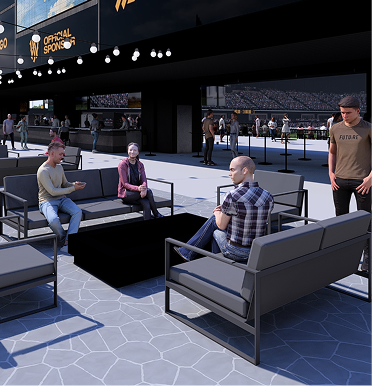 People sitting in the lounge area under the videoboard.